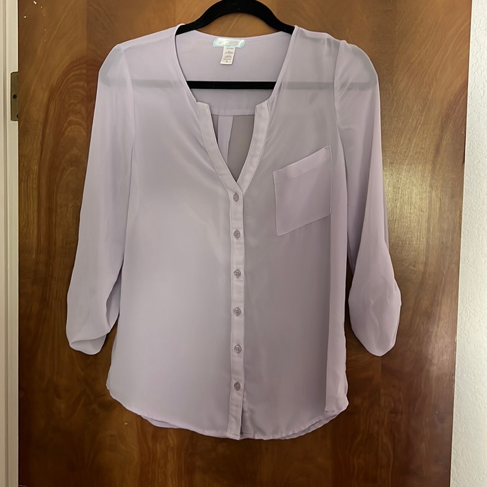 Sheer button up blouse.